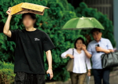 A Sudden Downpour in Seoul / An Exhibition Marks Liberation Day With Historic Flags - Photo News